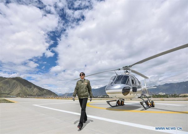 Female Pilot from Impoverished Family Flies Helicopter in China's Tibet