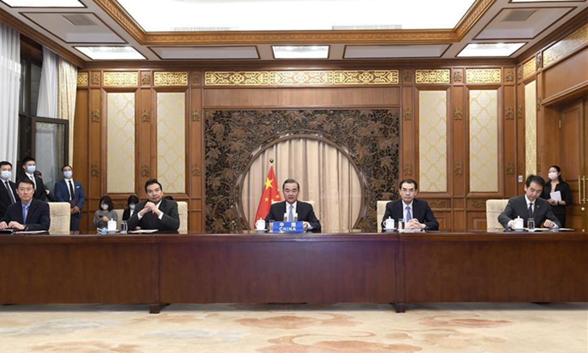 Chinese State Councilor and Foreign Minister Wang Yi hosts a video conference of foreign ministers of China, Afghanistan, Pakistan and Nepal on working together to fight COVID-19 and resume economy, July 27, 2020. Acting Minister of Foreign Affairs of Afghanistan Mohammed Haneef Atmar, Pakistani Foreign Minister Shah Mahmood Qureshi, Pakistani Minister for Economic Affairs Khusro Bakhtyar and Nepali Foreign Minister Pradeep Kumar Gyawali attended the video conference. (Xinhua/Yue Yuewei)